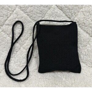 The Sak black small crochet crossbody bag with magnetic closure and a long strap
